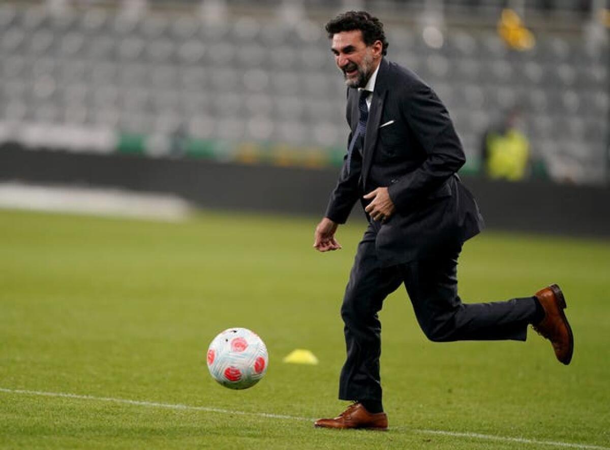 Newcastle chairman Yasir Al Rumayyan, the governor of the Saudi Public Investment Fund, plays football on the pitch at Newcastle's St James' Park