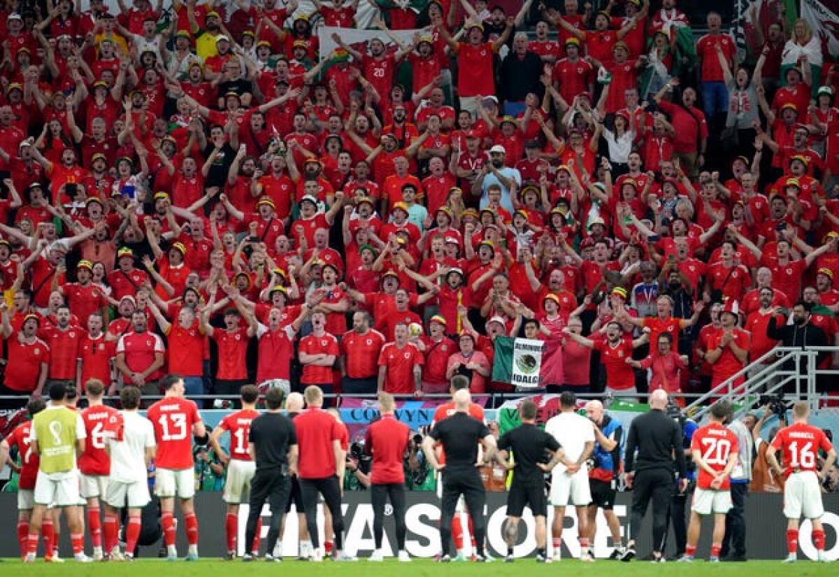 Wales' players applaud their supporters after defeat to England