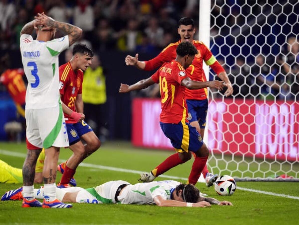 Italy’s Riccardo Calafiori (on the ground) reacts after scoring an own goal during the 1-0 Euro 2024 Group B defeat by Spain in Gelsenkirchen