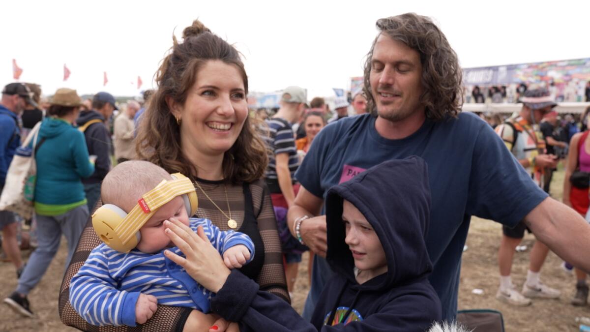 Ten-week-old Finlay (bottom left) with (left to right) his mother Rosie, sister Sofia and father Tom at Glastonbury