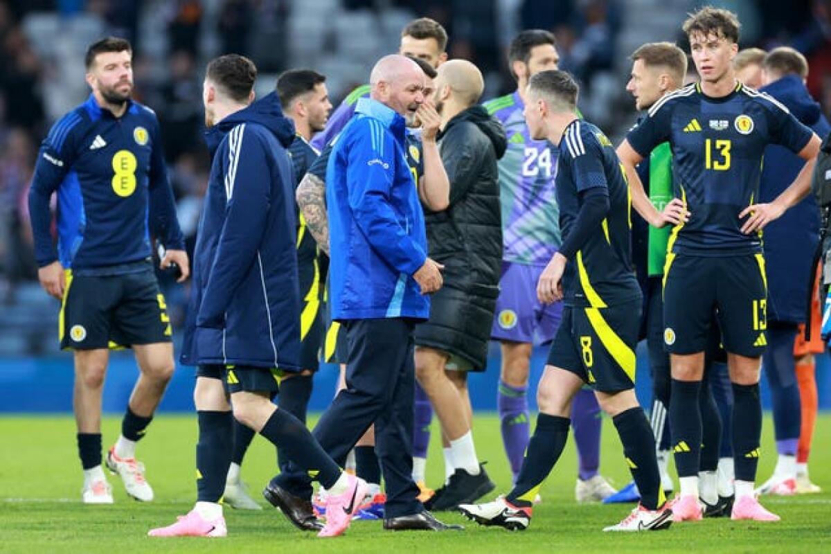 Steve Clarke, centre, with his players after Scotland's draw with Finland