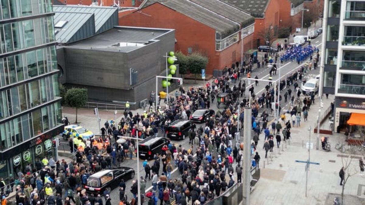 The funeral procession of Shane MacGowan after crossing Mac Mahon Bridge in Dublin