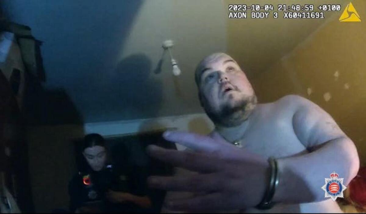 Gavin Plumb in handcuffs as he is arrested