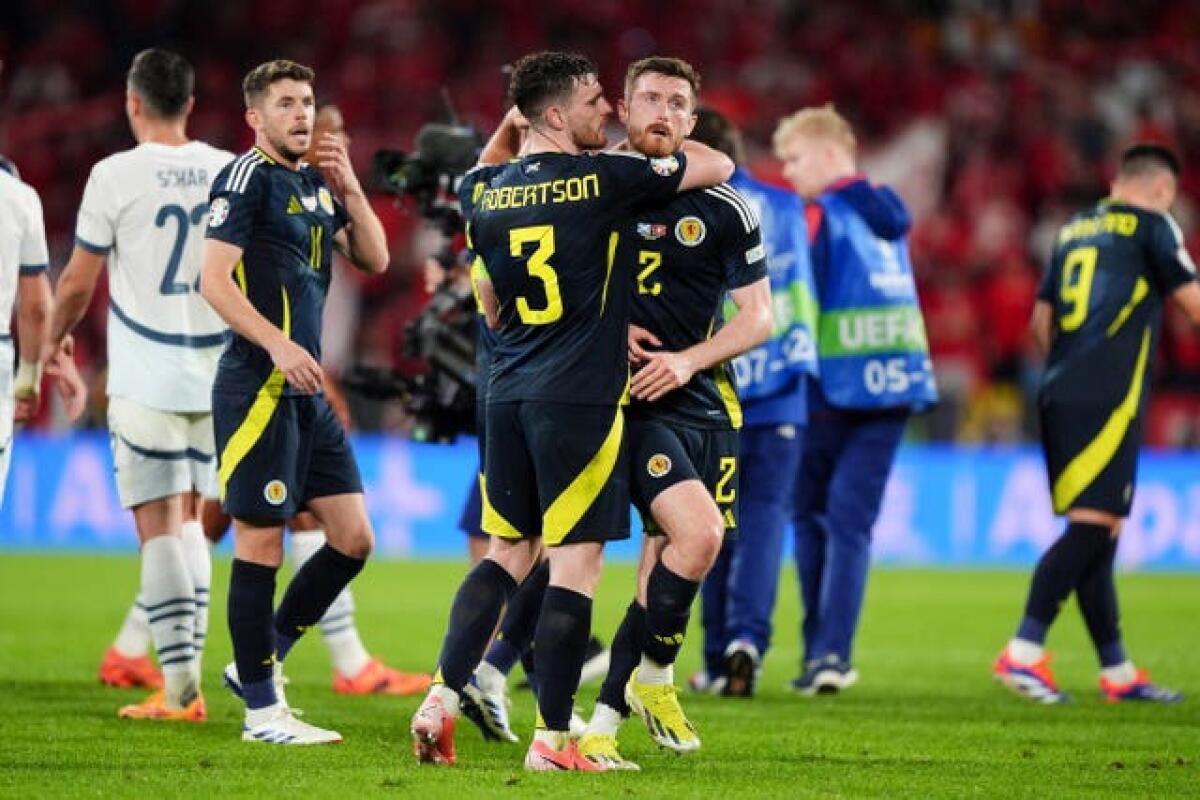 Scotland’s Andrew Robertson (left) embraces Anthony Ralston after the 1-1 draw with Switzerland in Cologne