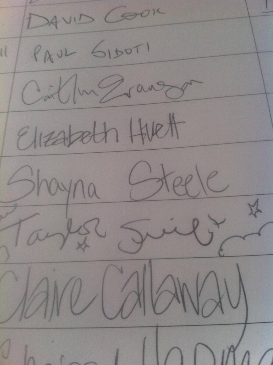 A close-up photo of a guest book signed by Taylor Swift