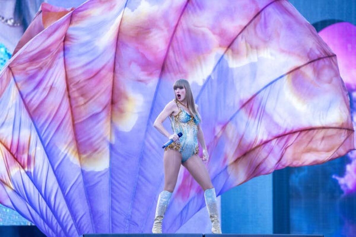 Taylor Swift dances on stage as she performs on the Eras tour at Murrayfield Stadium in Edinburgh