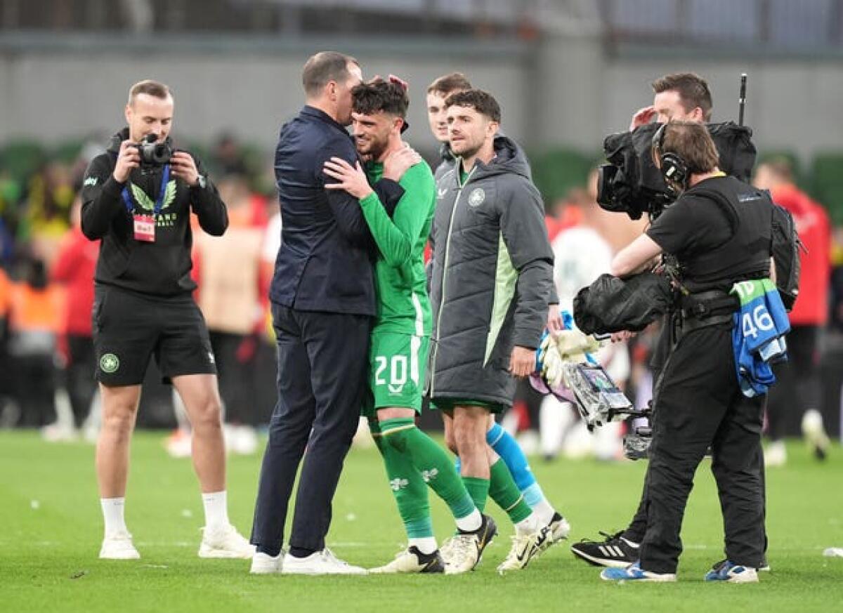 Republic of Ireland interim manager John O’Shea congratulates match-winner Troy Parrott after the final whistle
