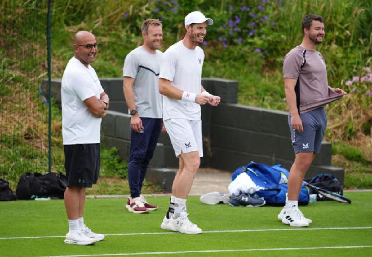 Andy Murray with his coaching team on the practice court 