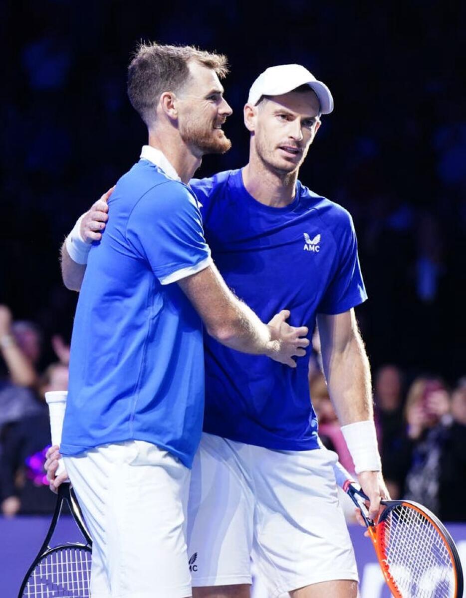 Andy, right, and Jamie Murray embrace