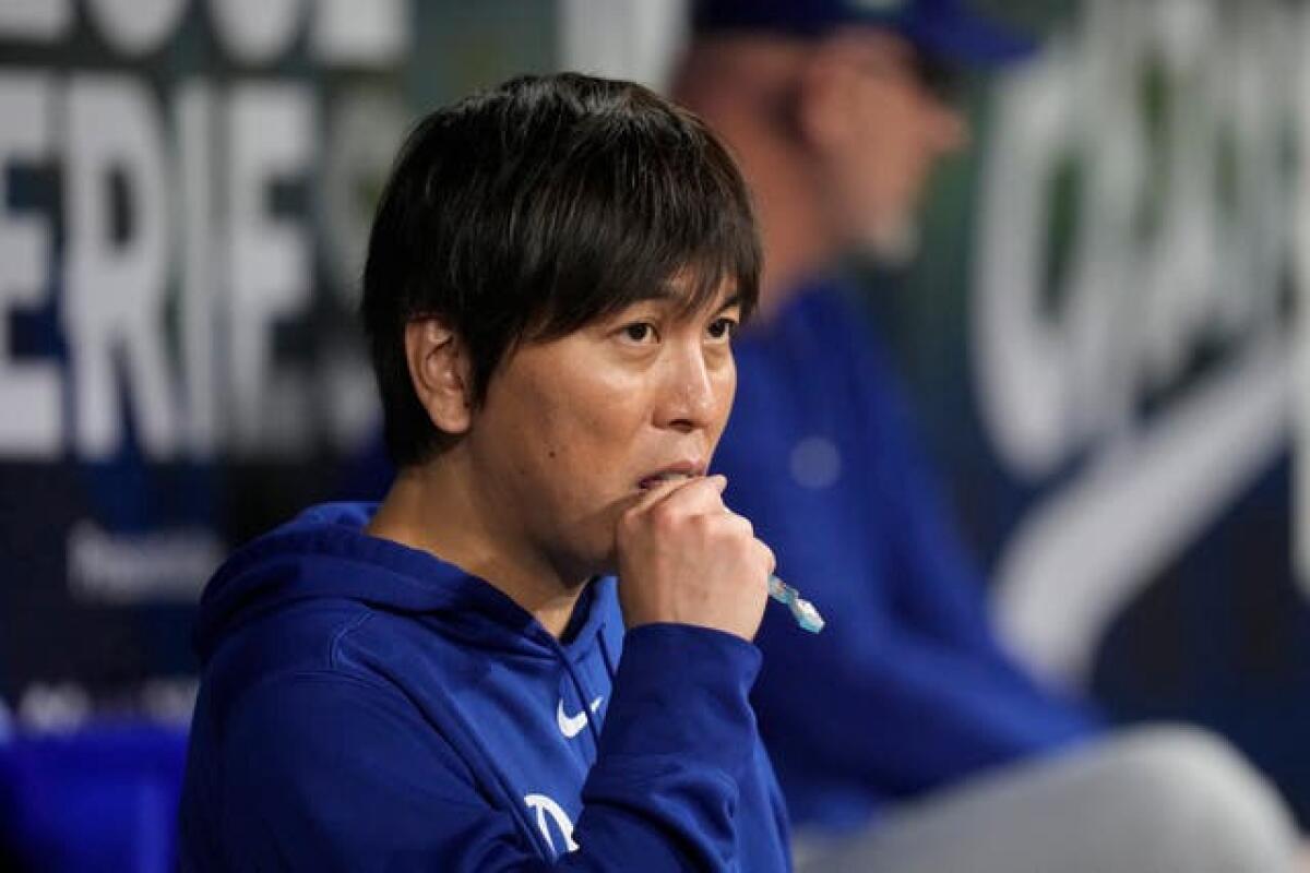 Los Angeles Dodgers designated hitter Shohei Ohtani’s interpreter Ippei Mizuhara stands in the dugout during an opening day baseball game against the San Diego Padres at the Gocheok Sky Dome in Seoul, South Korea 