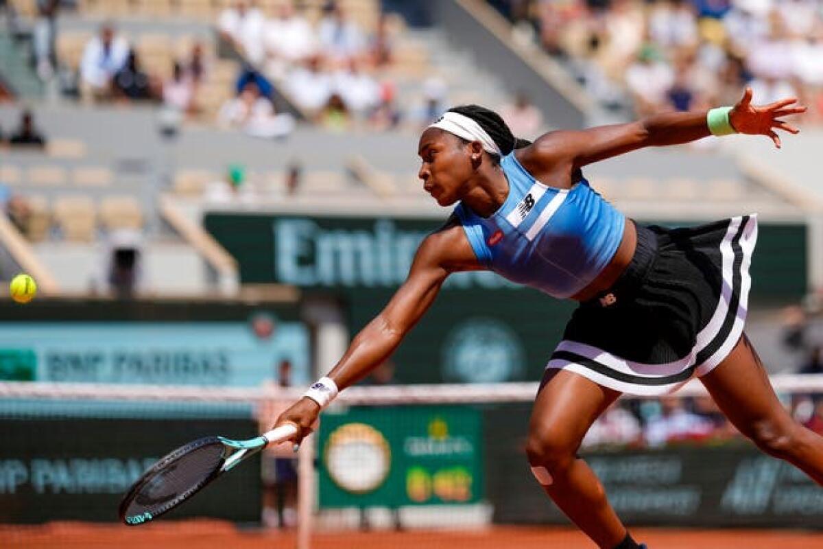 Coco Gauff lunges for a backhand