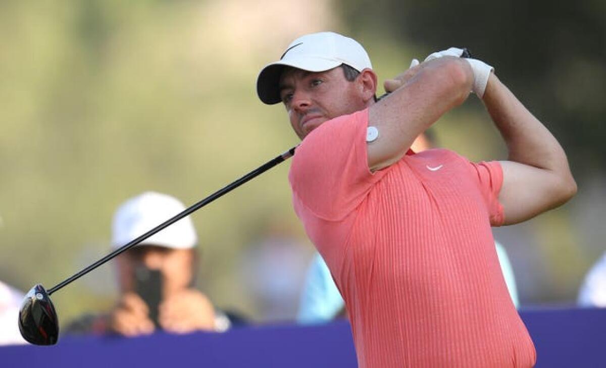 Rory McIlroy tees off at the 18th hole in Dubai 