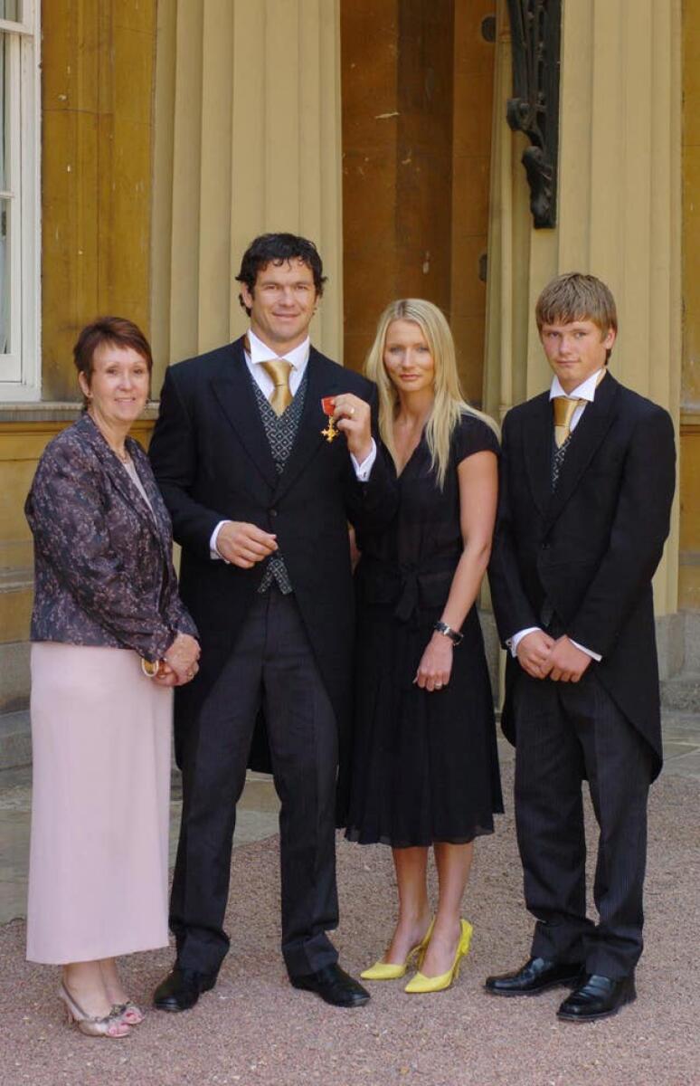 Andy Farrell, second left, collects his OBE in 2005 alongside wife Colleen, second right, son Owen, right, and mother Carol, left wife Colleen, son Owen and mother Carol (left) as he celebrates becoming an Officer of the Most Excellent Order of the British Empire (OBE).
