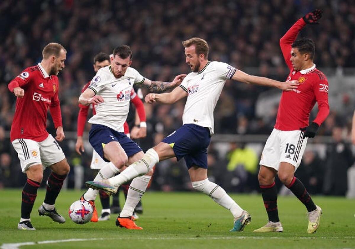 Harry Kane (centre) in action for Tottenham