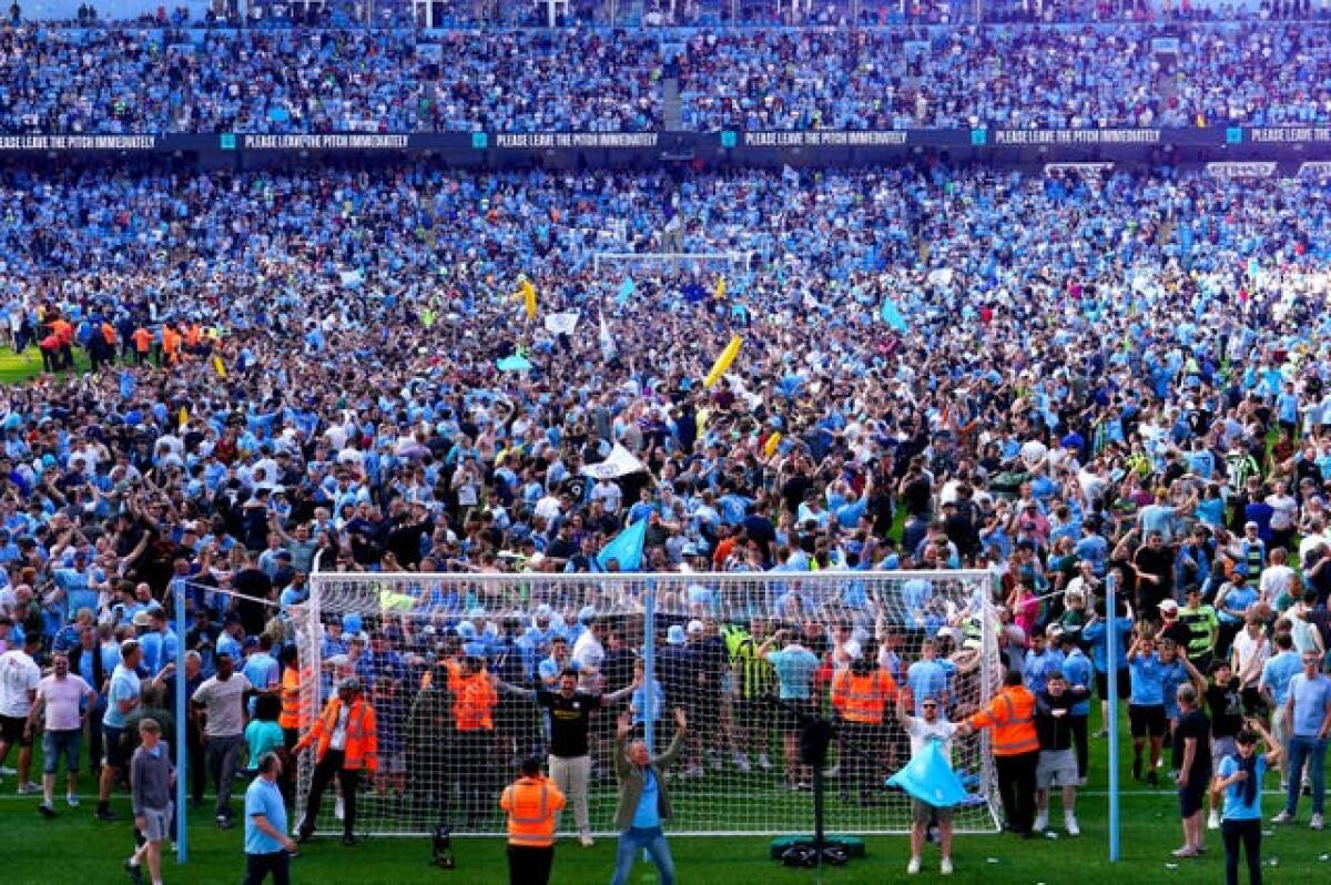 Manchester City fans invade the pitch to celebrate the club's Premier League title win. Arsenal's 1-0 loss at Nottingham Forest the previous day confirmed treble-chasing City as champions, allowing manager Pep Guardiola to make a raft of changes for the 1-0 win over Chelsea. Julian Alvarez's early goal decided the game as the hosts enjoyed a memorable final home game of the campaign. Brentford were the only visiting team to triumph at the Etihad Stadium during the season thanks to a shock 2-1 success in November