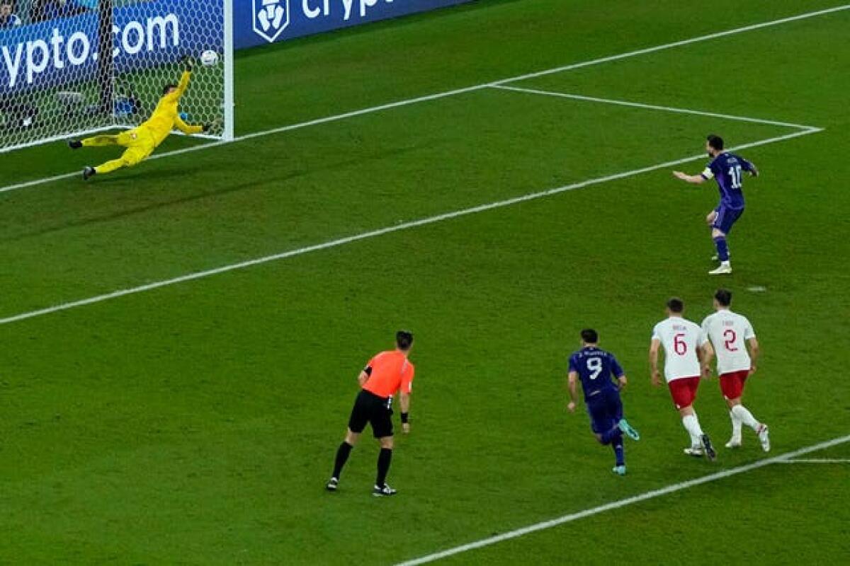 Wojciech Szczesny, left, saves Lionel Messi's penalty