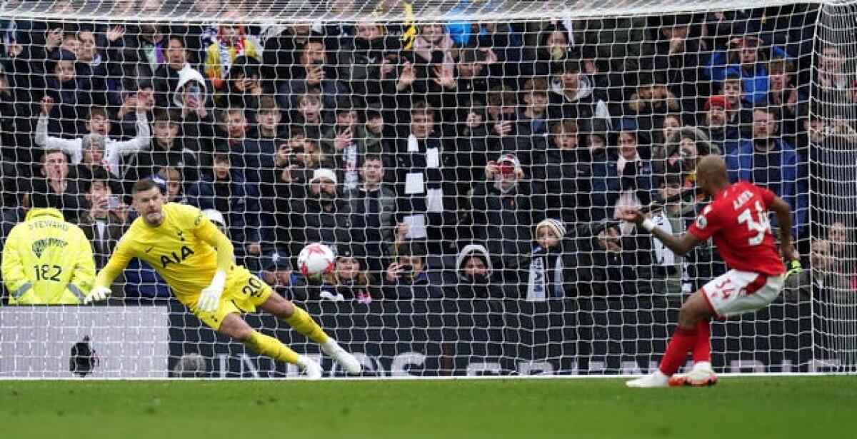 Fraser Forster saves a late penalty from Andre Ayew 