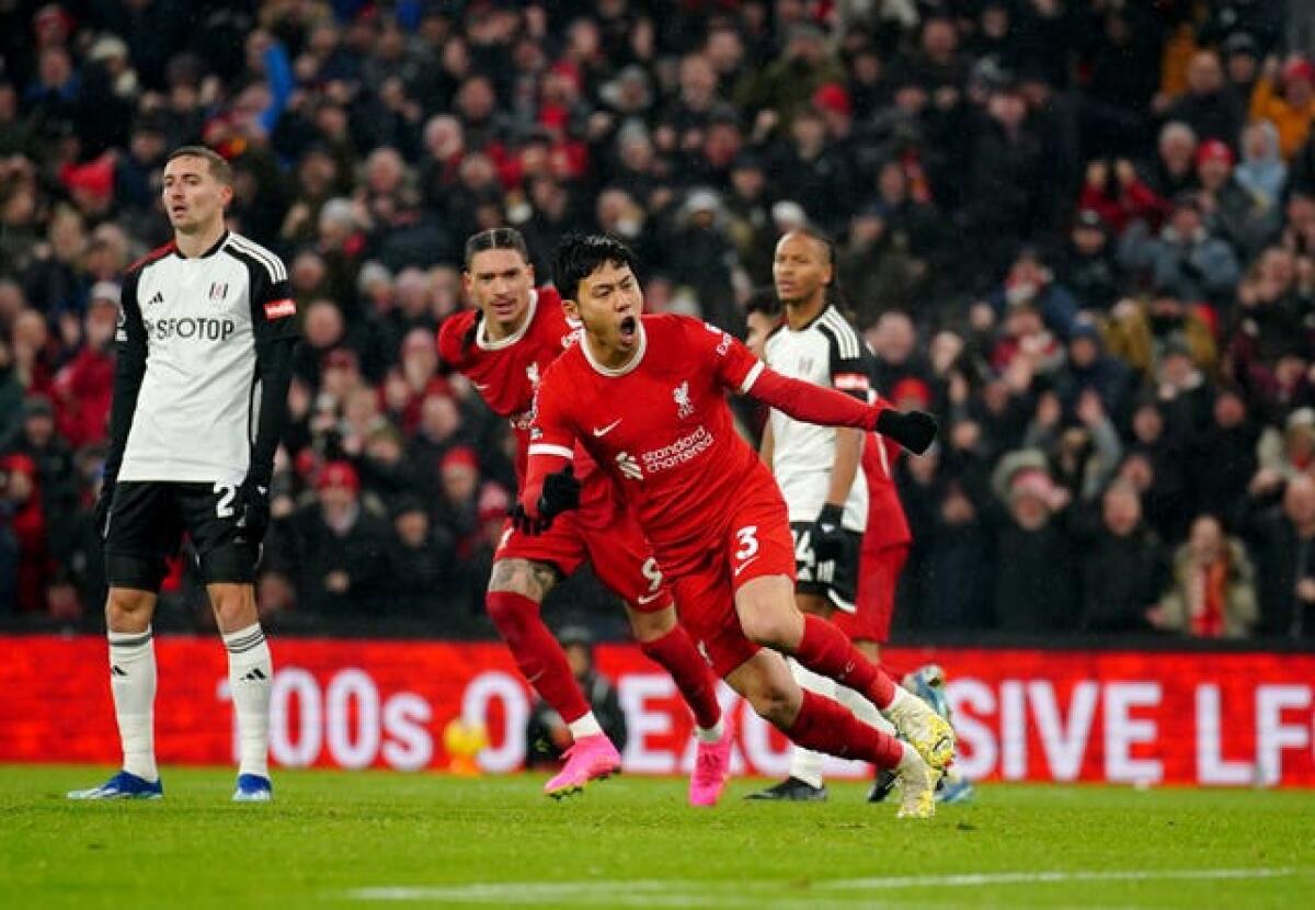Liverpool's Wataru Endo (centre) celebrates scoring his sides third goal